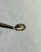 Gold ring with gemstones on a white background