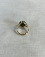 back view gold ring on beige fabric background